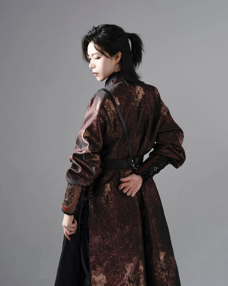 a man wearing a dark Chinese Reversible Hanfu Robe coat  against a gray background