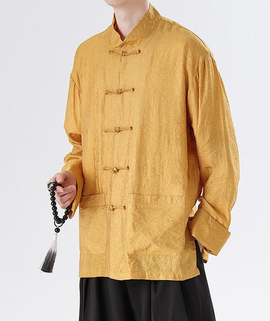 Person wearing a mustard yellow traditional Men's Oriental Jacquard Kung Fu Tang Shirt on a white background
