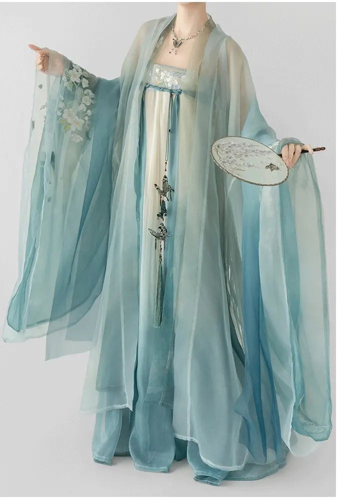 Person wearing a green Floral Traditional Chinese Tang Dynasty Hanfu Dress  with flowing sleeves on a white background