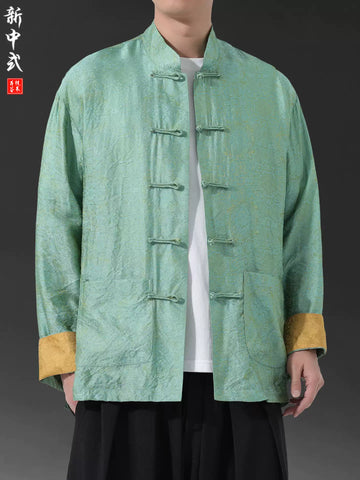 Green traditional Men's Oriental Jacquard Kung Fu Tang Shirt with gold cuffs on a gray background