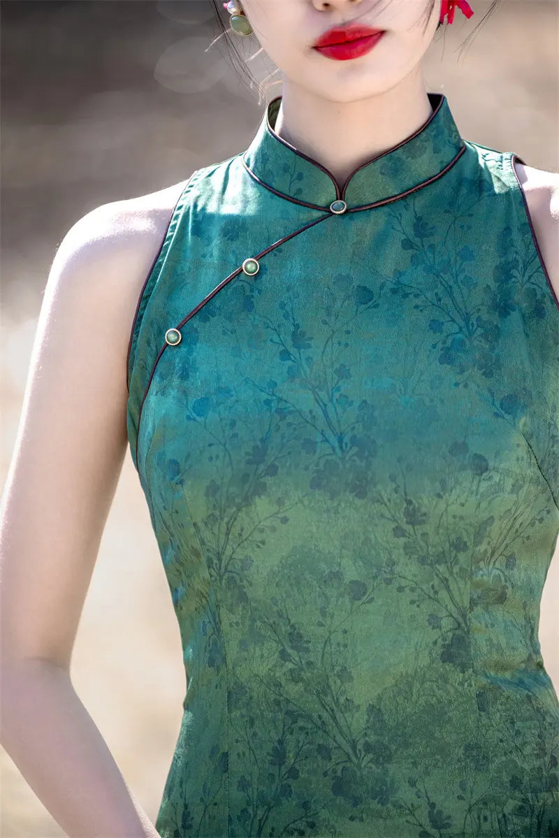 Green traditional dress with floral pattern worn by a person.