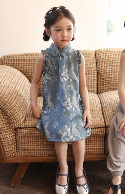 a chinese kid girl in blue sleeveless cheongsam dress 