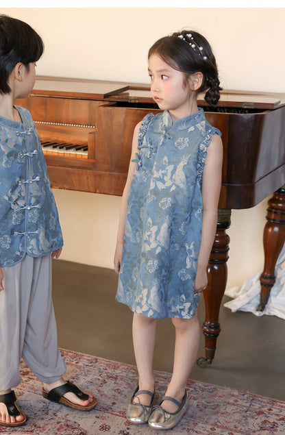 a girl kid in blue qipao dress 