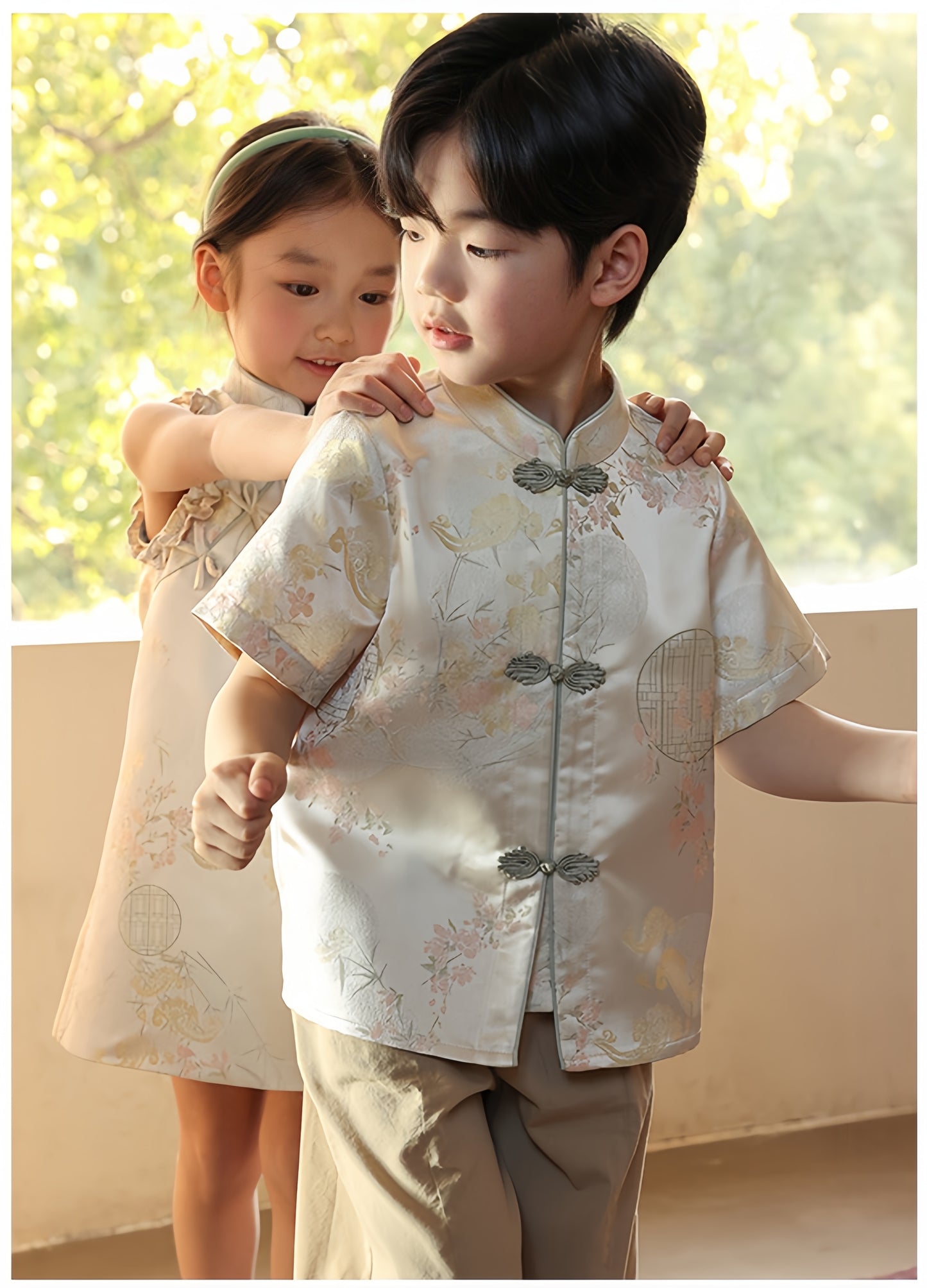 a chinese boy in short sleeve satin white tang jacket