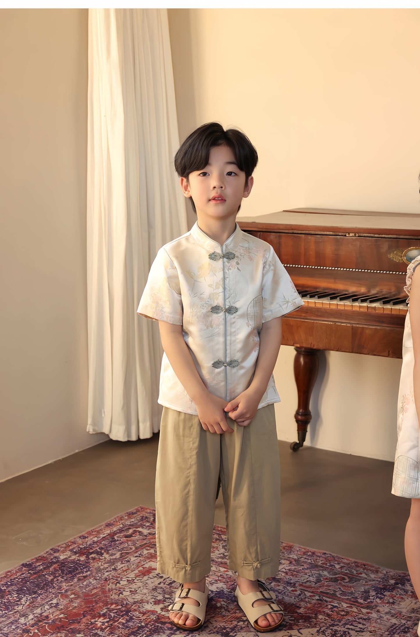 a chinese boy in short sleeve tang jacket