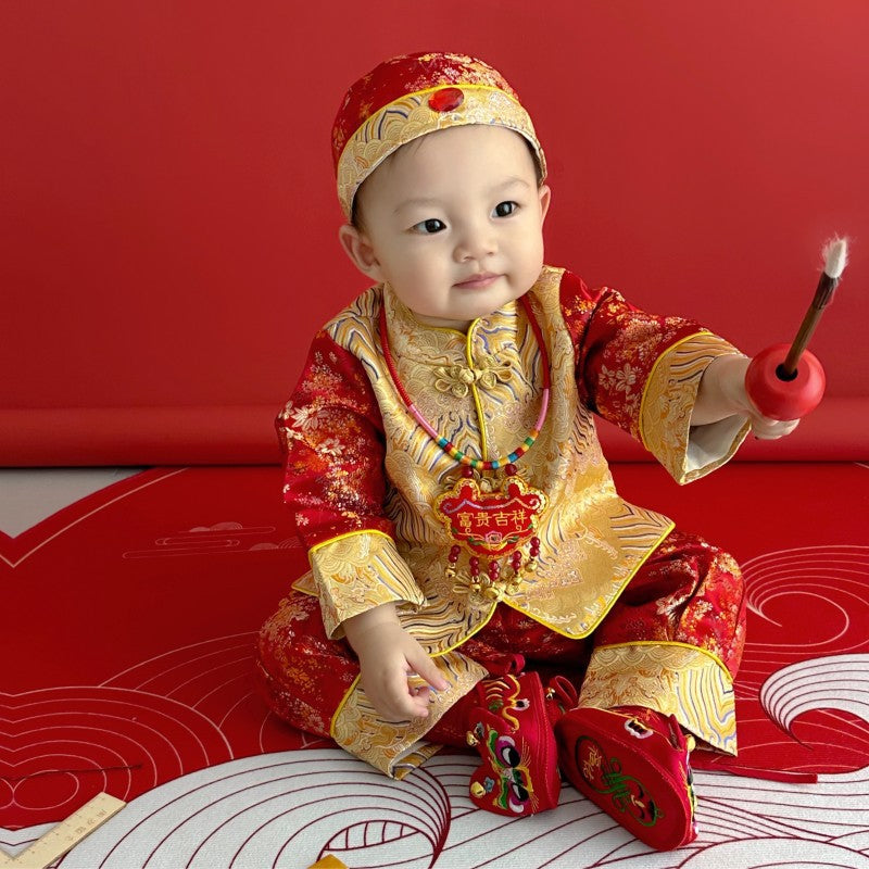 A chinese baby in long sleeves Red and Golden Tang Jacket Set with hat