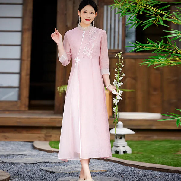 Woman in a Floral Embroidered Loose A line pink  Cheongsam Qipao Dress  holding flowers outdoors