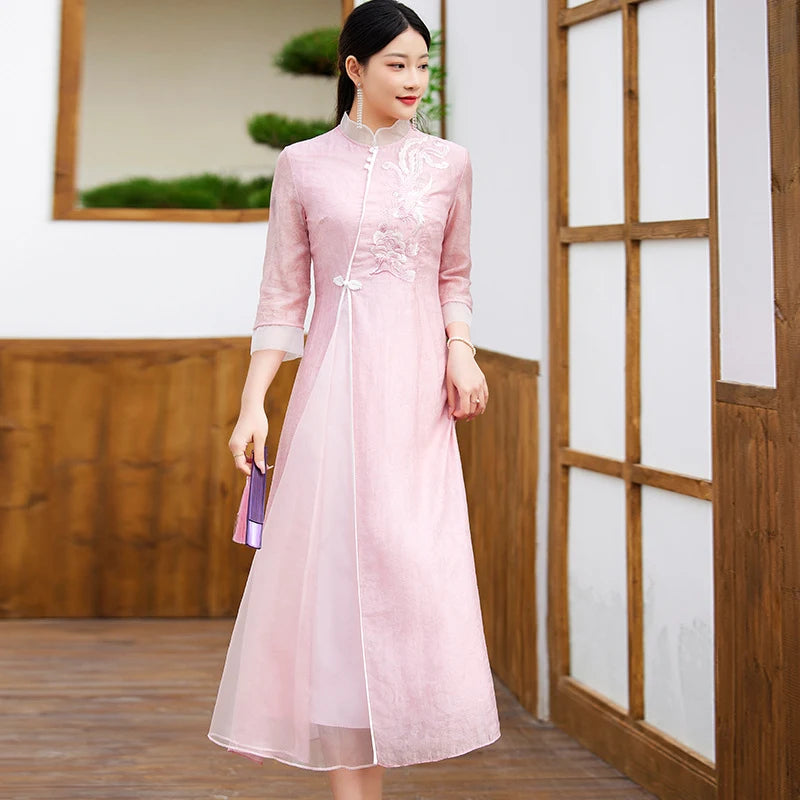 Woman wearing Floral Embroidered Loose A line pink chinese Cheongsam Qipao Dress  in a wooden interior setting