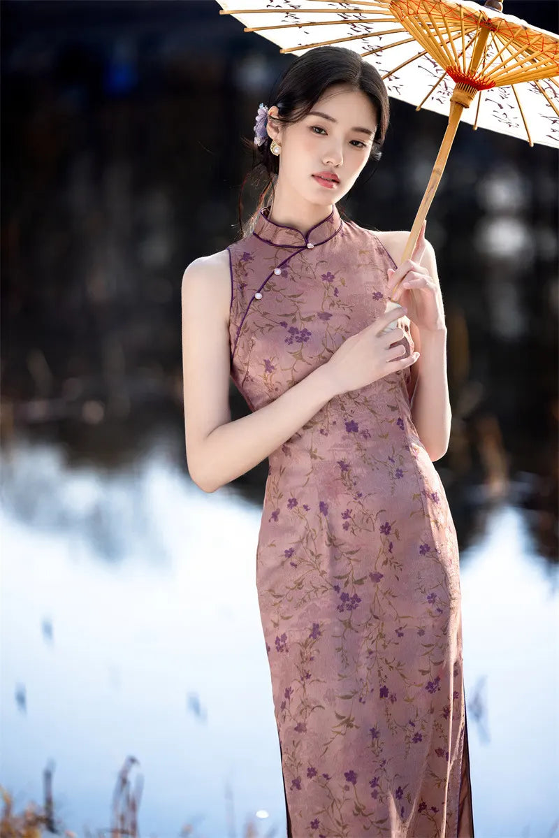 Woman in a pink Modern Chinese Mandarin Dress Sleeveless Qipao  holding an umbrella with a blurred background