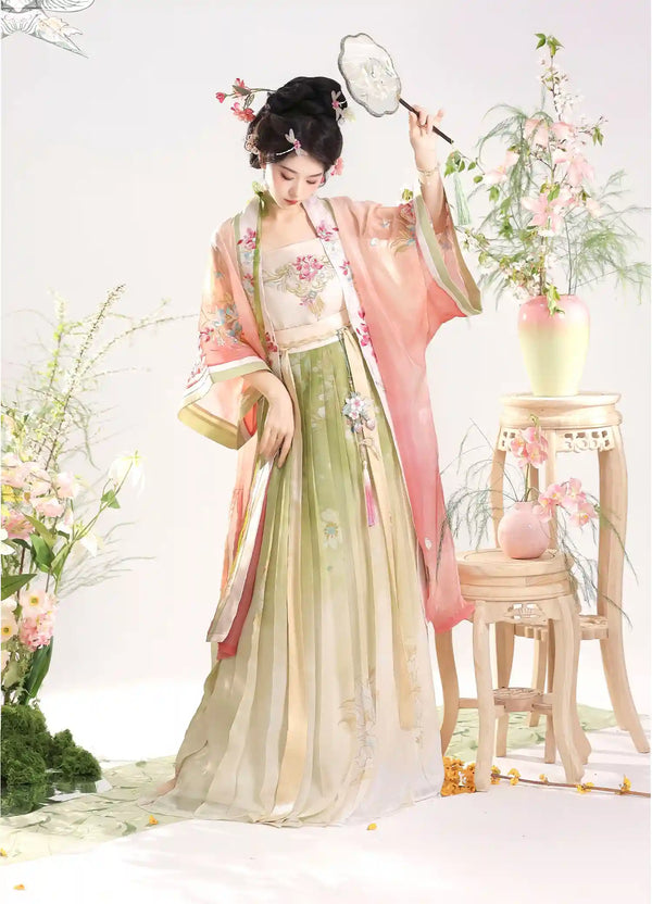 Woman in Traditional Chinese Dress – Elegant pink Song Dynasty Hanfu Set  with floral decorations in a decorative setting