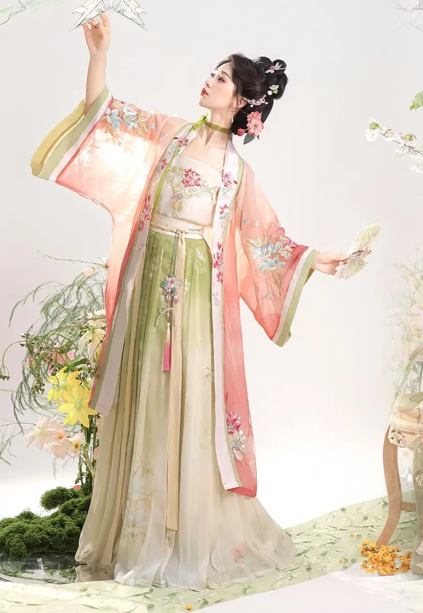 Woman in pink traditional Chinese Dress – Elegant Song Dynasty Hanfu Set  attire with floral patterns on a light background