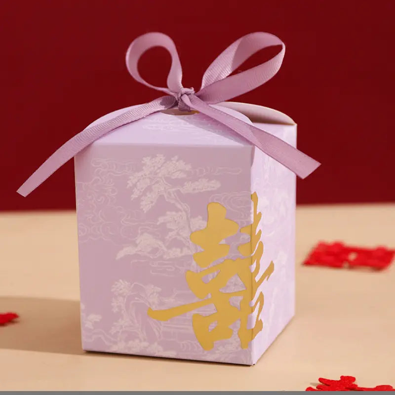 purple Gold Foil Double Happiness Chinoiserie Wedding Favor Boxes  with a pink ribbon on a red background