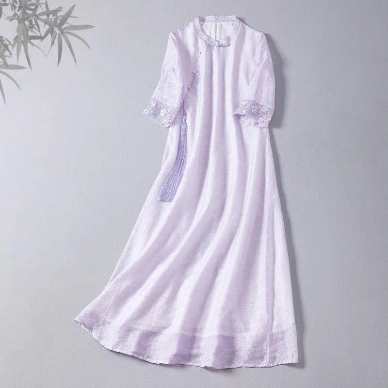 Lavender dress with lace details on a gray background