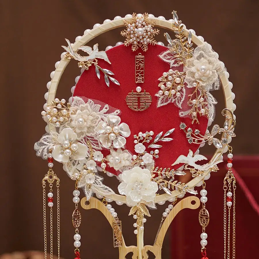 Red Chinese Bridal Round Hand Fan with Tassels , floral and pearl details on a red background