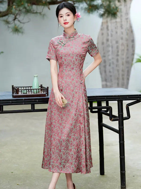 Woman in a pink Modern Floral Short Sleeve A-Line Qipao Dress  standing outdoors with a blurred background