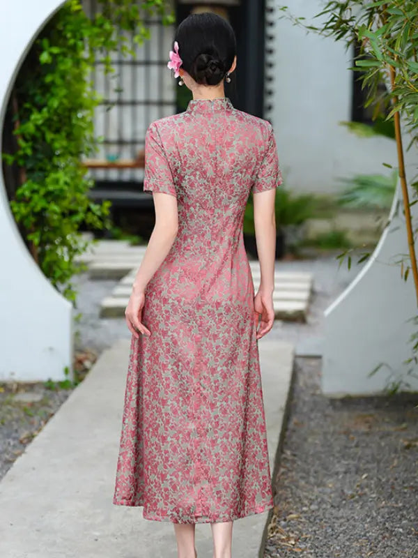 Woman in a pink Modern Floral Short Sleeve A-Line Qipao Dress  standing in a garden setting