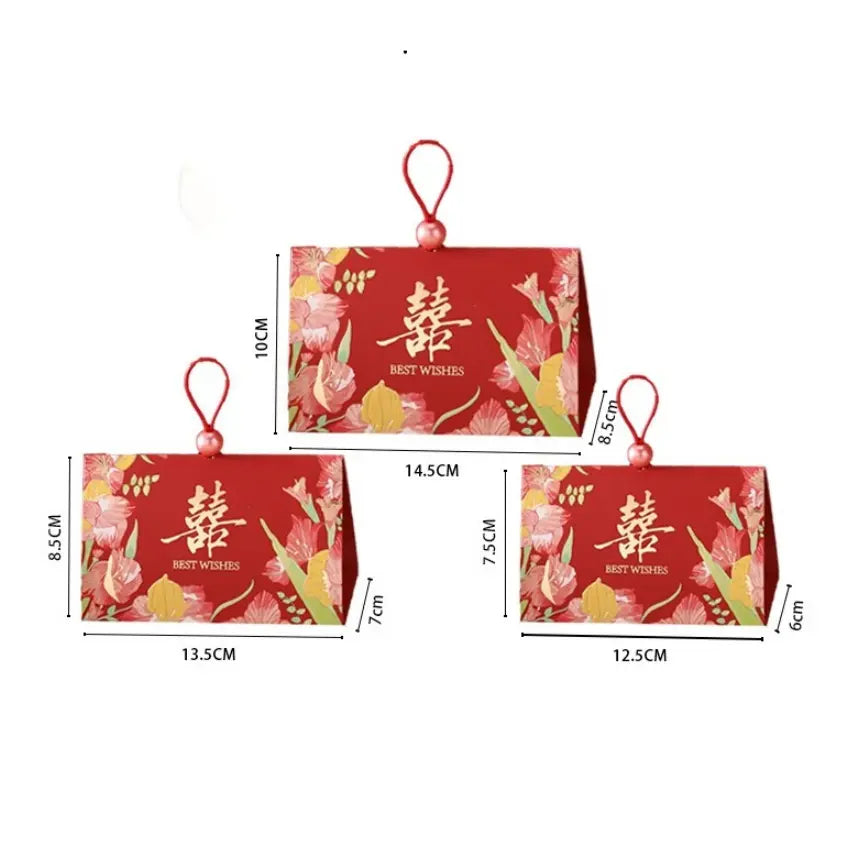 Three rec Triangular Chinese  Double Happiness Wedding Favor Boxes with Pearl Loop with floral prints and gold Chinese characters, shown with dimension labels on a white background.