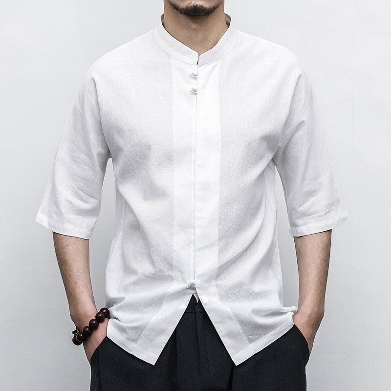 Person wearing a white Men’s Linen Cotton Chinese Mandarin Collar Shirt with black pants on a plain background