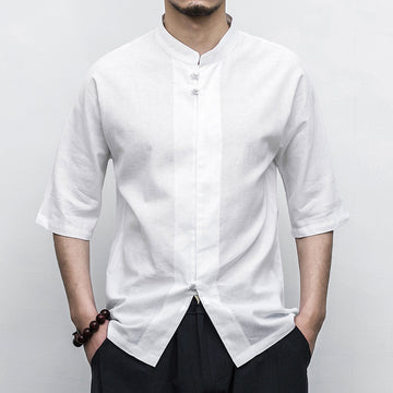 Person wearing a white Men’s Linen Cotton Chinese Mandarin Collar Shirt with black pants on a plain background
