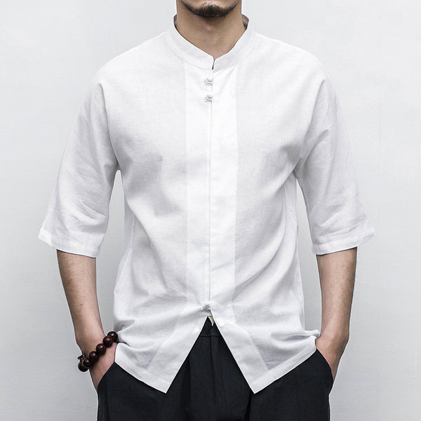 Person wearing a white Men’s Linen Cotton Chinese Mandarin Collar Shirt with black pants on a plain background