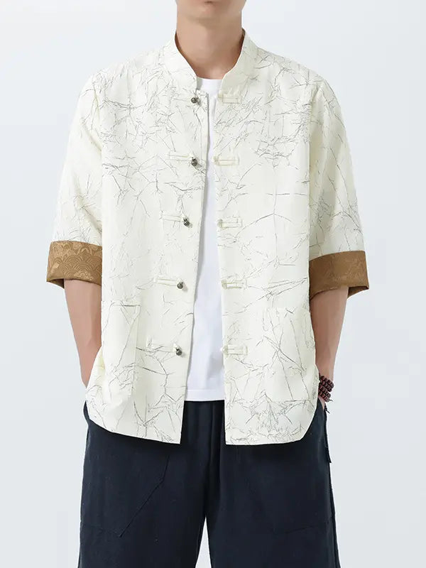 Person wearing a white Men's Retro Crinkle Texture Half Sleeve Tang Suit Summer patterned shirt with brown trim on a white background