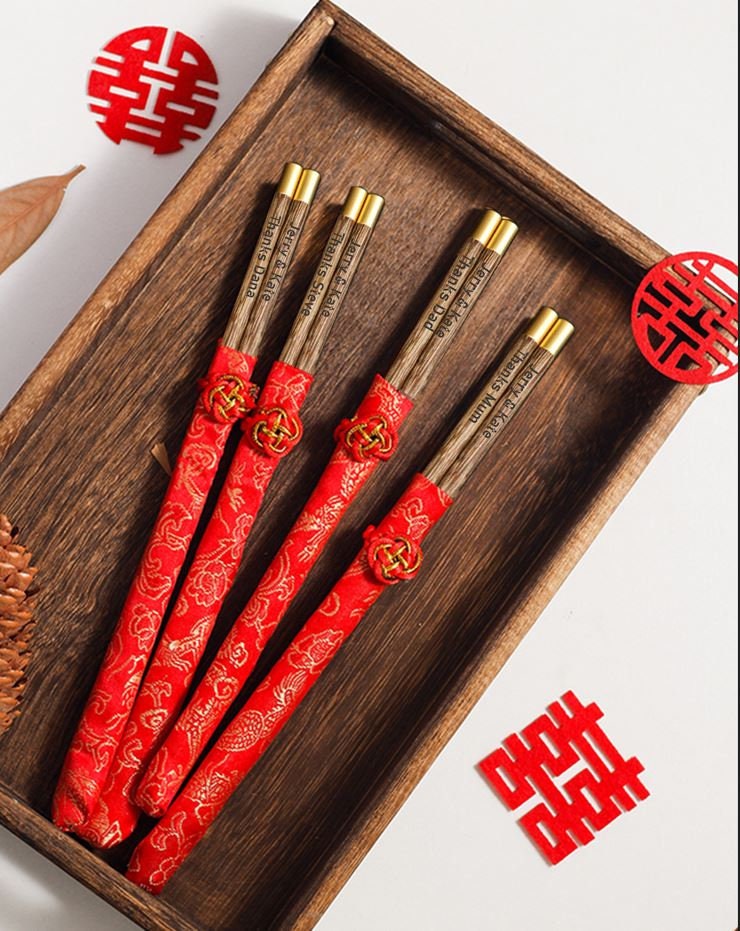 personalized wooden chopsticks with engraved names date logo , and silk sleeve for wedding favor